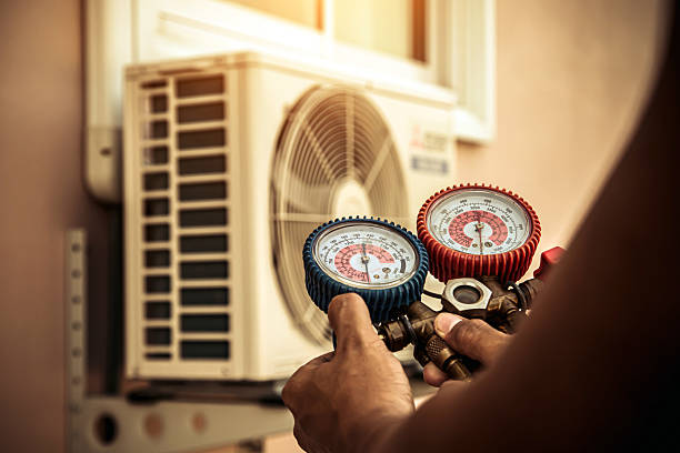 Professional Air Conditioning Service technician working in Douglas, MA